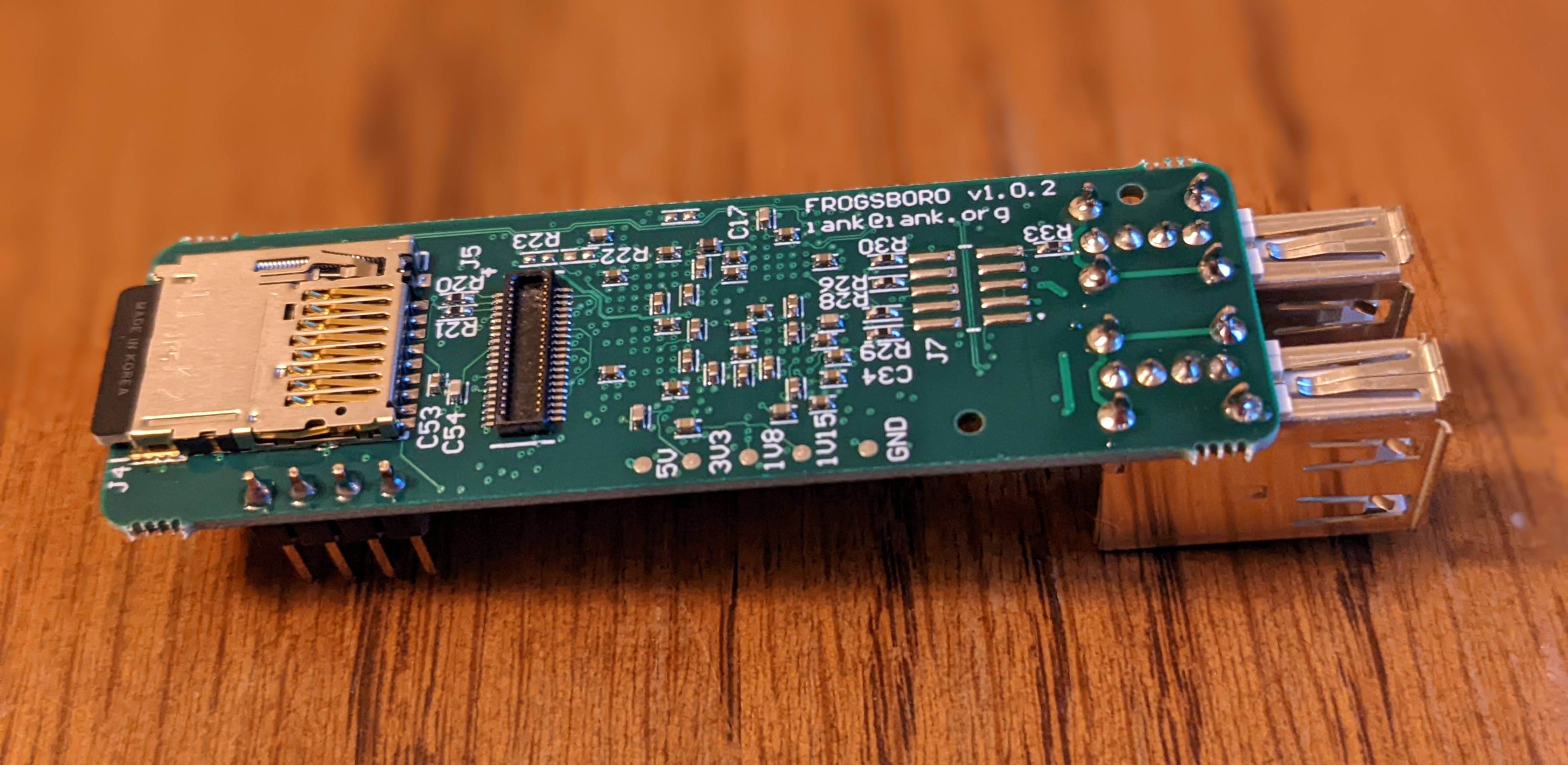 There is a microSD card connector on one end and a 40-pin low-profile board-to-board connector nearby.